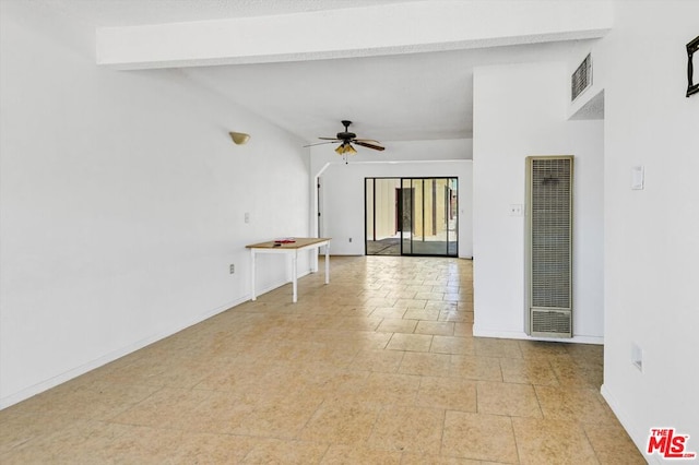 interior space with vaulted ceiling with beams and ceiling fan