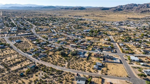 drone / aerial view featuring a mountain view