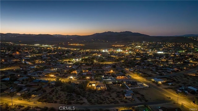 aerial view at dusk with a mountain view