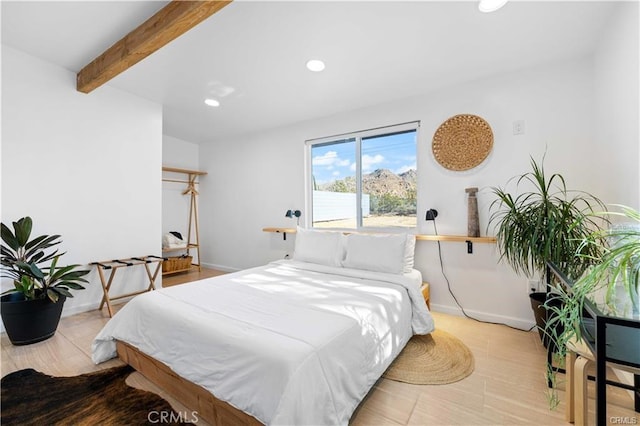 bedroom featuring beamed ceiling