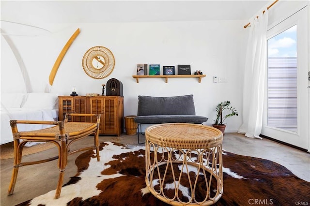 living area with concrete floors