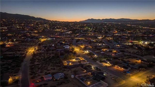 aerial view at dusk with a mountain view