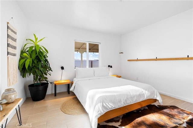 bedroom featuring light wood-style flooring