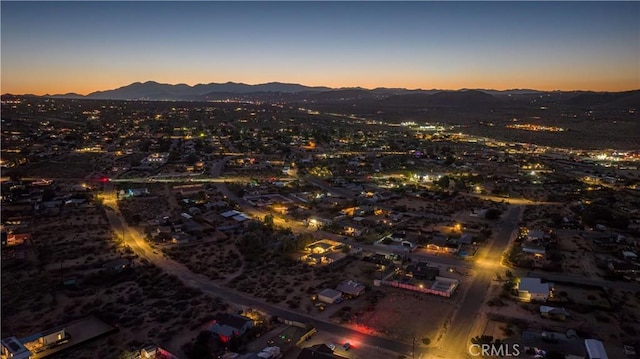 birds eye view of property with a mountain view