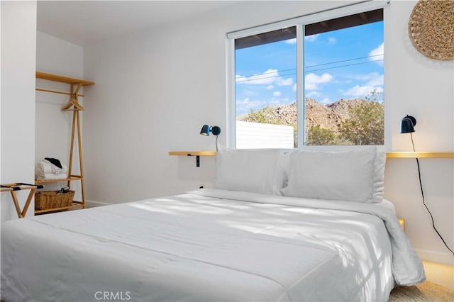 bedroom with a mountain view