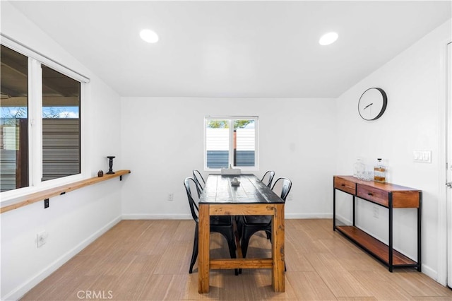 dining area with light wood finished floors, recessed lighting, and baseboards