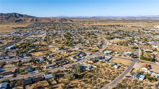 drone / aerial view featuring a residential view and a mountain view