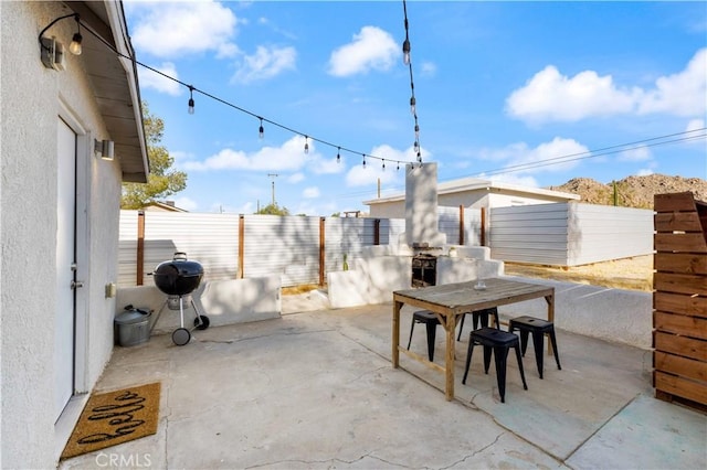 view of patio / terrace with outdoor dining area and a fenced backyard
