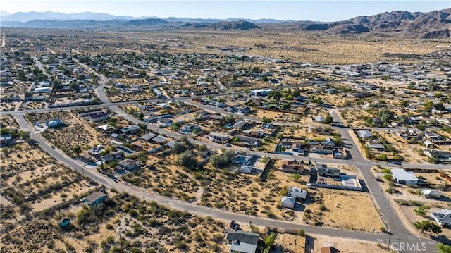 birds eye view of property featuring a residential view and a mountain view