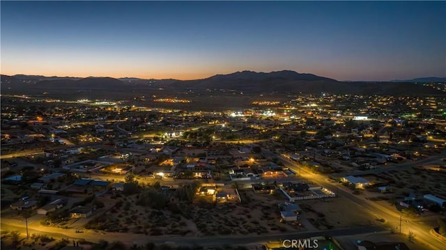 aerial view at dusk with a mountain view