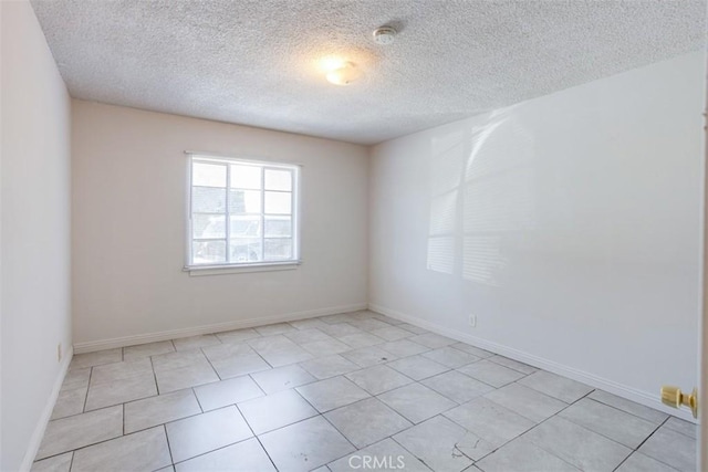 empty room with a textured ceiling