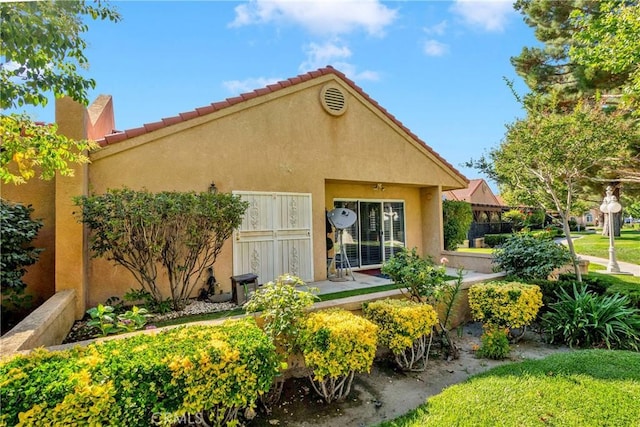 11611 Park Ln, Apple Valley, CA 92308 - rear view of property featuring stucco siding and a tile roof