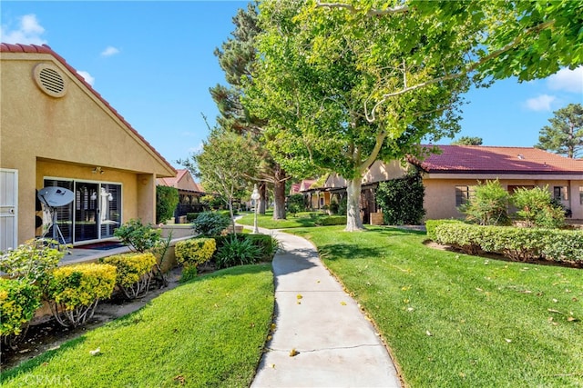 view of home's community featuring a lawn