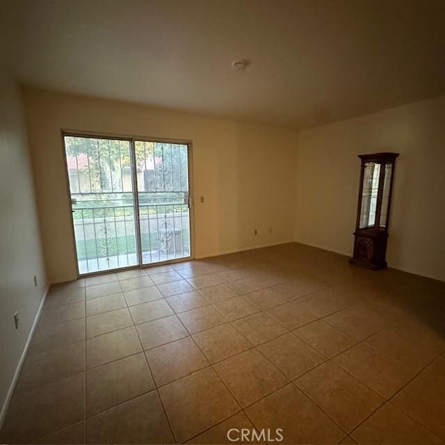 11611 Park Ln, Apple Valley, CA 92308 - empty room featuring tile patterned flooring and baseboards