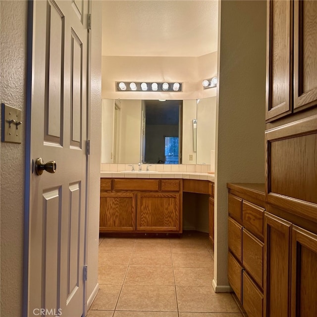 bathroom with tile patterned floors and vanity