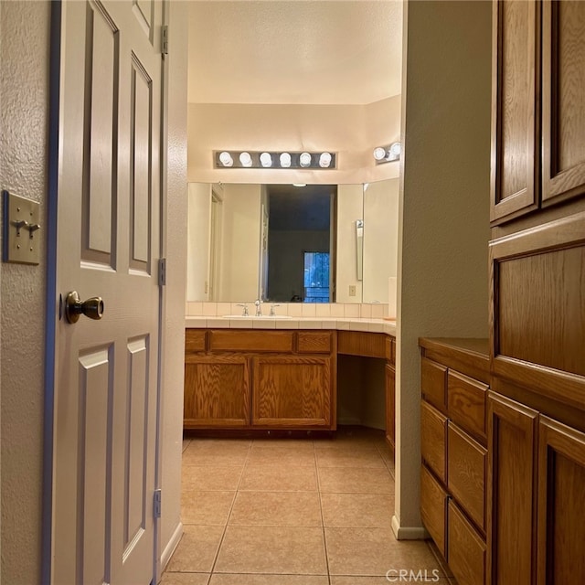 11611 Park Ln, Apple Valley, CA 92308 - bathroom featuring tile patterned flooring, a textured wall, and vanity