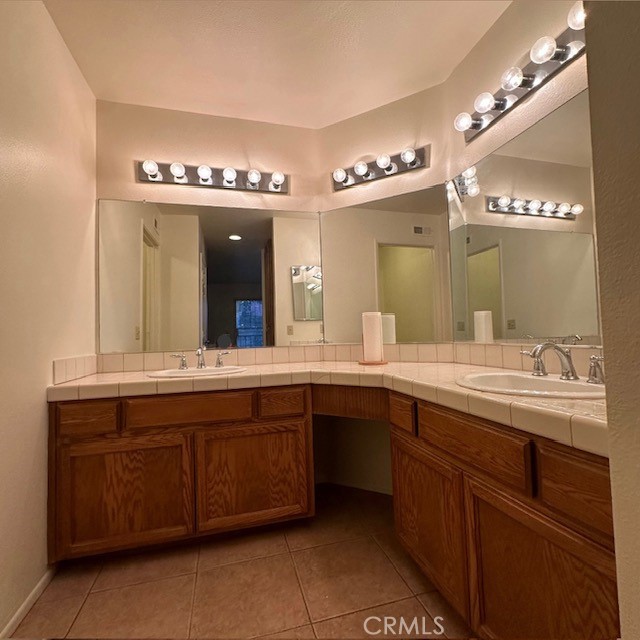 bathroom featuring tile patterned floors and vanity