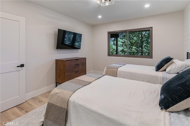 bedroom with light hardwood / wood-style flooring