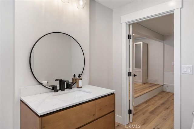 bathroom featuring wood-type flooring and vanity