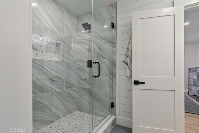 bathroom with a shower with shower door