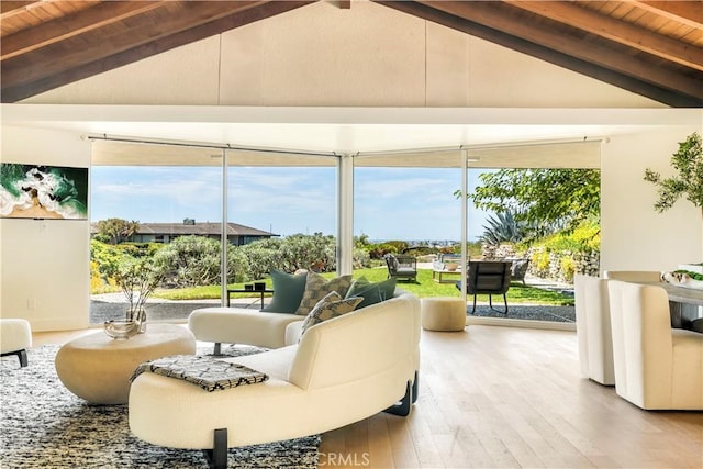 interior space with vaulted ceiling with beams and wood ceiling