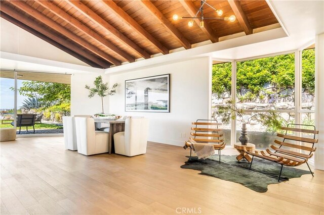 living area with wooden ceiling, high vaulted ceiling, light hardwood / wood-style flooring, ceiling fan, and beamed ceiling