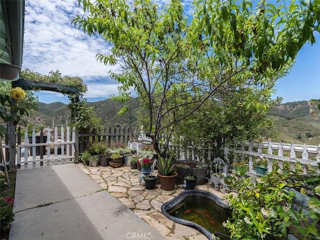 view of patio / terrace featuring a mountain view