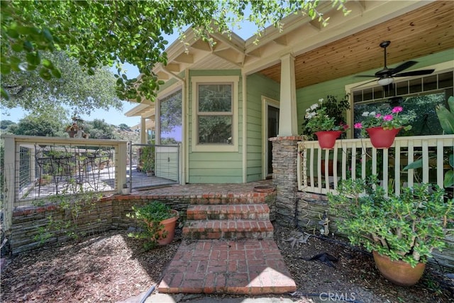 entrance to property with ceiling fan