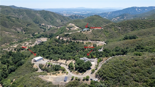 drone / aerial view featuring a mountain view