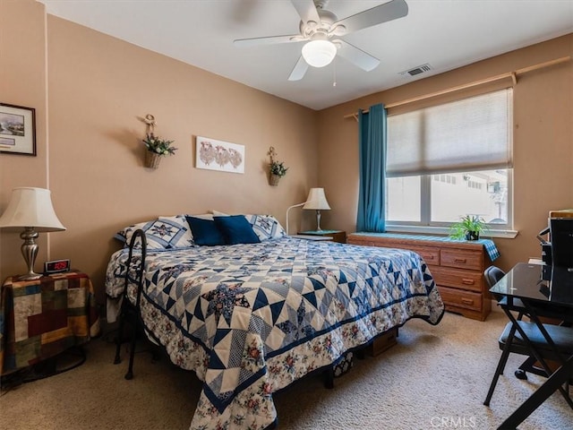 bedroom with light colored carpet and ceiling fan