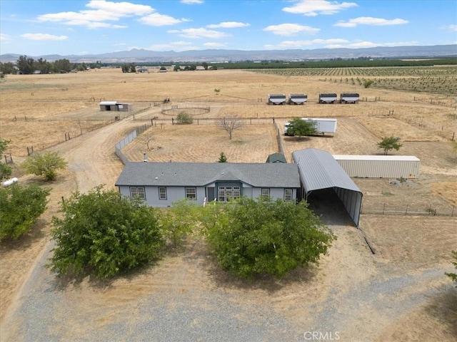 aerial view with a mountain view and a rural view