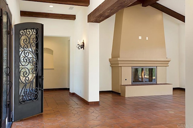 interior space with lofted ceiling with beams