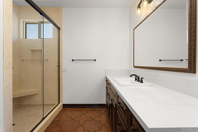 bathroom with vanity, tile patterned floors, and a shower with shower door