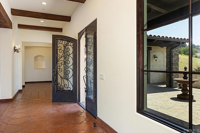 hallway with recessed lighting, baseboards, and beam ceiling
