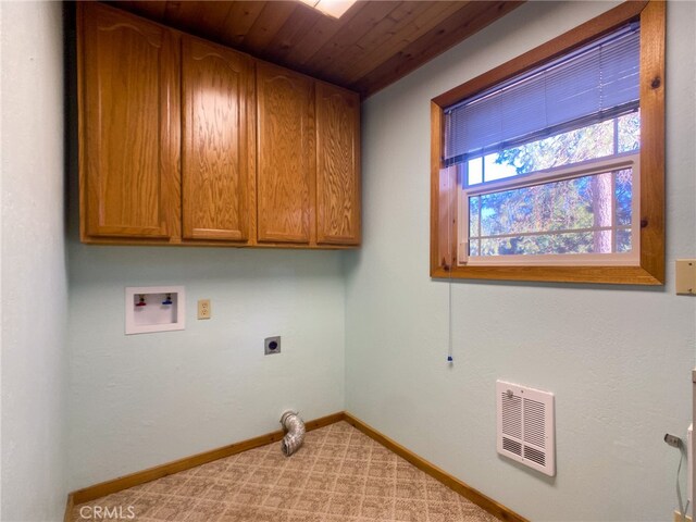 laundry area featuring hookup for a washing machine, cabinets, light colored carpet, and hookup for an electric dryer