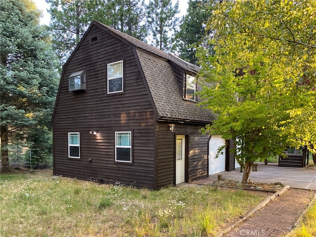 view of side of property with a garage