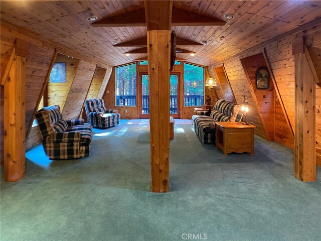 interior space featuring wood ceiling, wood walls, carpet, and vaulted ceiling