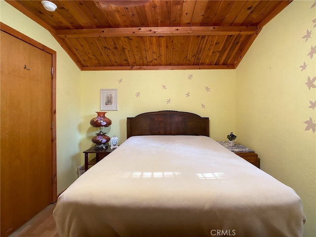 bedroom featuring wood ceiling and lofted ceiling with beams