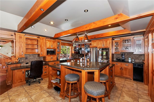 kitchen featuring appliances with stainless steel finishes, tasteful backsplash, and light tile floors