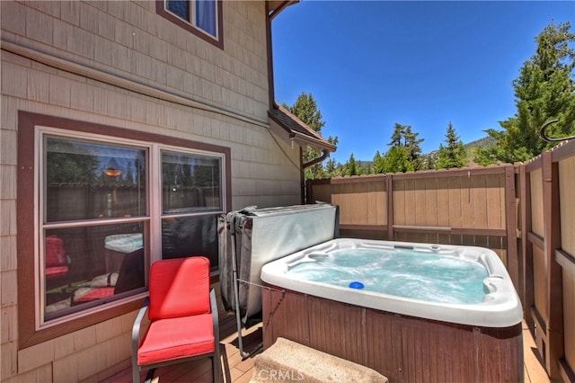 view of patio with a hot tub