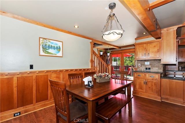 dining room with ornamental molding and dark hardwood / wood-style floors