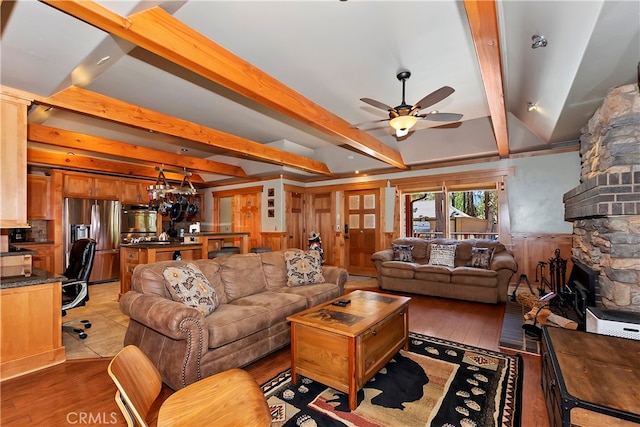 living room with beam ceiling, tile floors, a fireplace, and ceiling fan