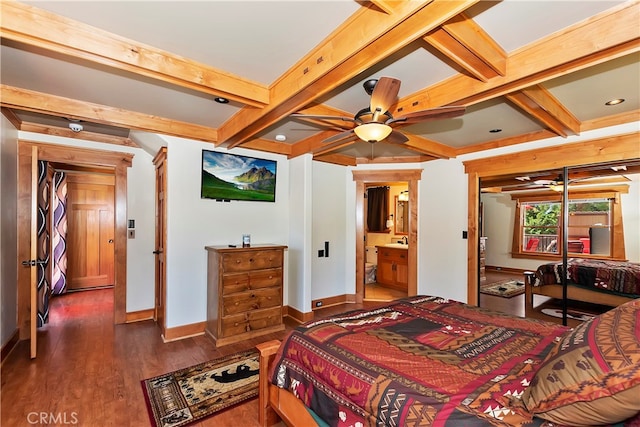 bedroom featuring beamed ceiling, ensuite bath, hardwood / wood-style floors, coffered ceiling, and ceiling fan