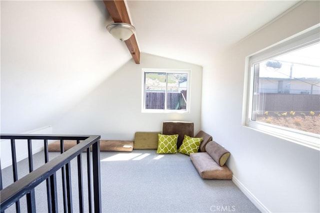 carpeted bedroom with lofted ceiling with beams