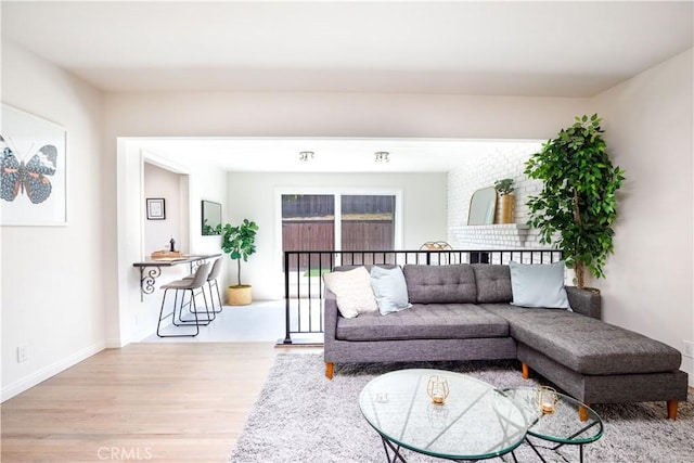 living room with light hardwood / wood-style flooring