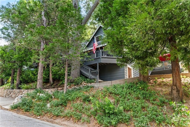 view of side of home with a balcony