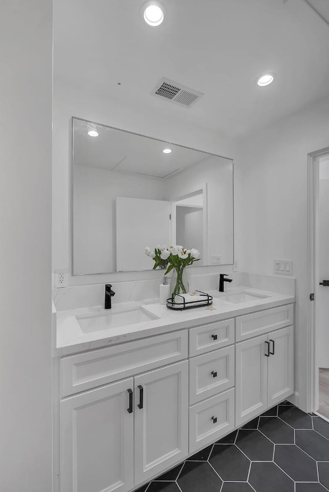 bathroom featuring tile patterned floors and vanity