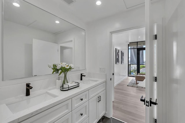 bathroom featuring vanity and wood-type flooring