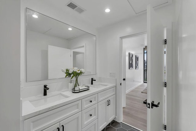 bathroom with tile patterned floors and vanity