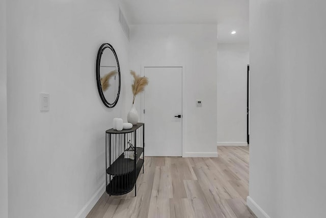 hallway with light wood-type flooring